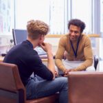 Faculty meeting in office with student in Masters in Counseling program