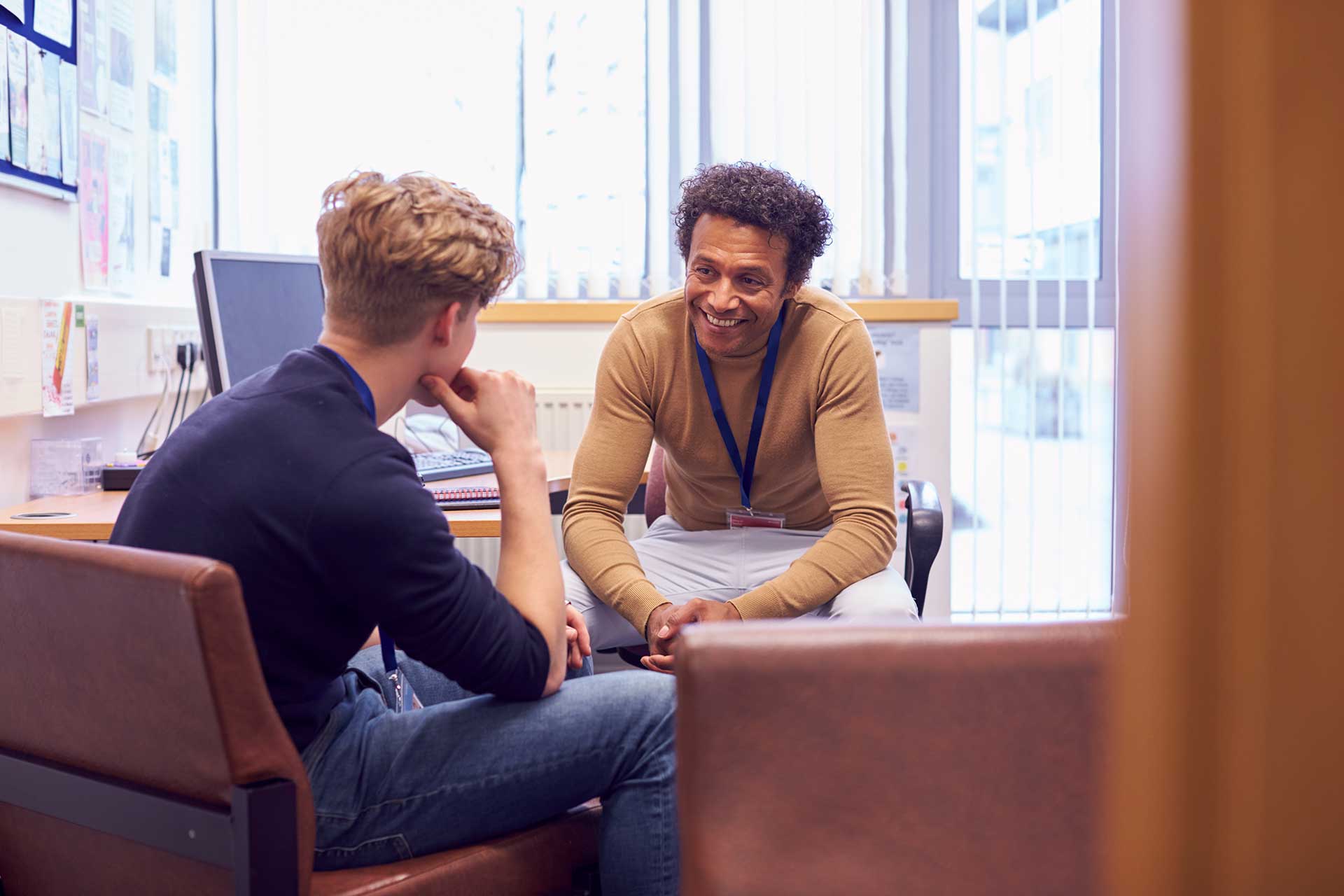 Faculty meeting in office with student in Masters in Counseling program